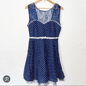 Blue and white lace swing dress with polka dots and open back